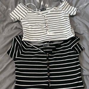 2 black and white body suits